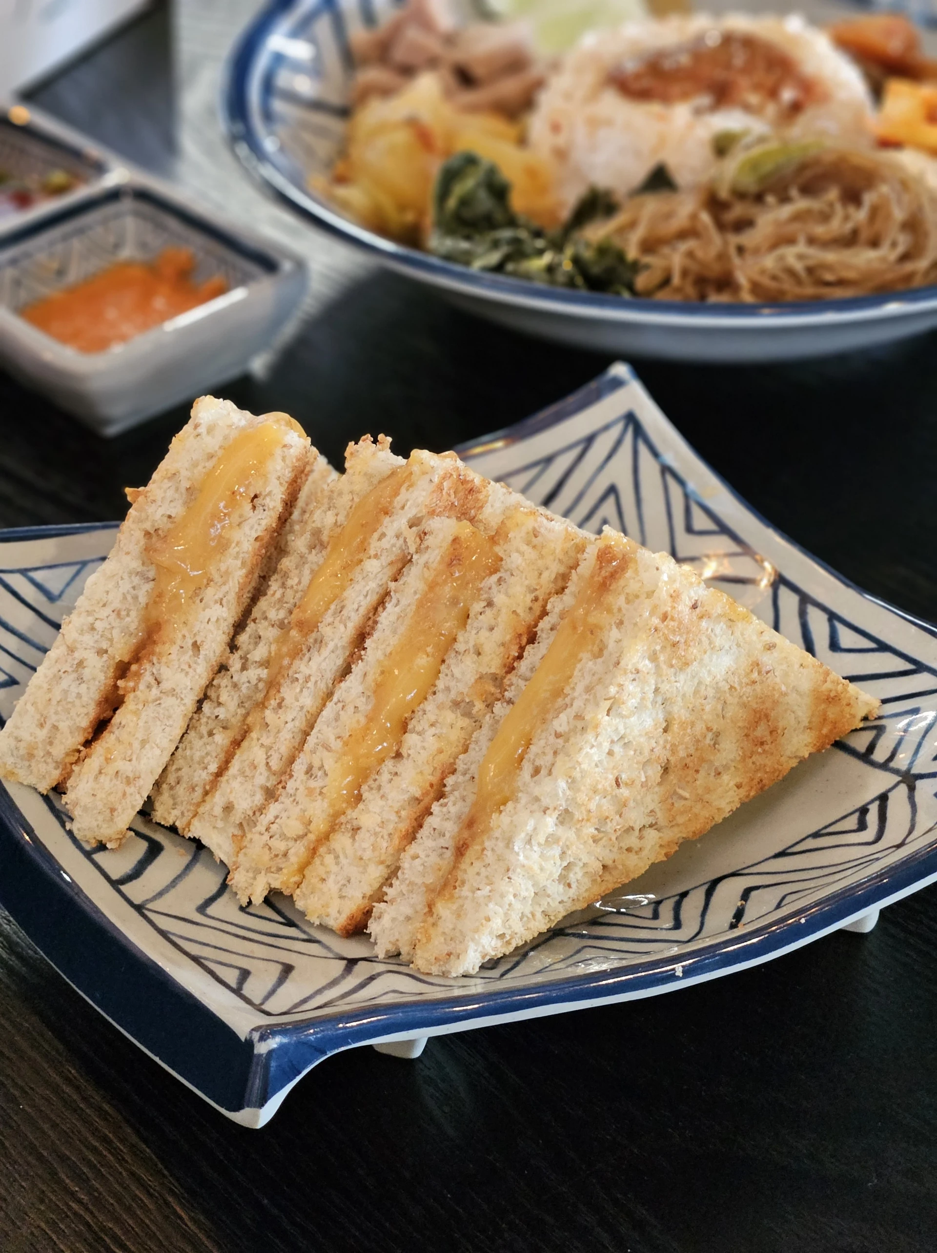 Simple, sliced kaya toast on a plate.