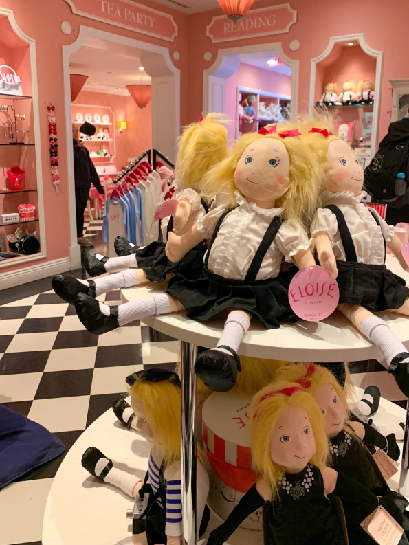 Eloise dolls on a table in the store at The Plaza NYC