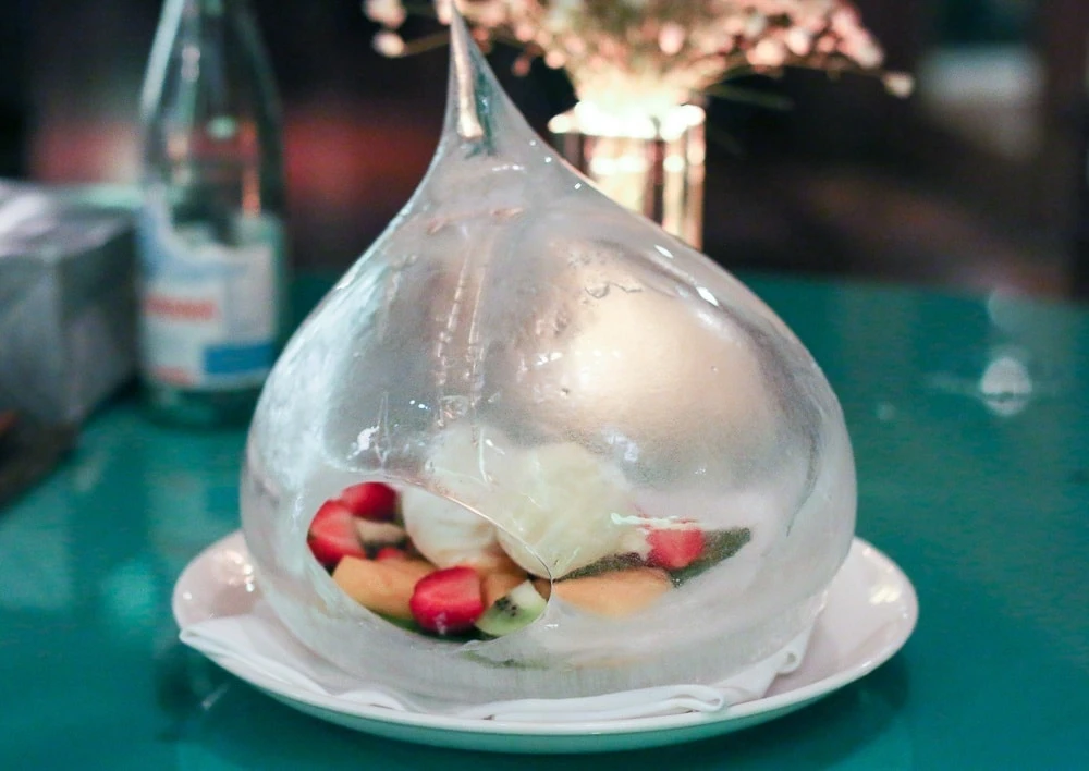 The special occasion dessert of fruit inside an ice sculpture at Peppino restaurant in Kota Kinabalu