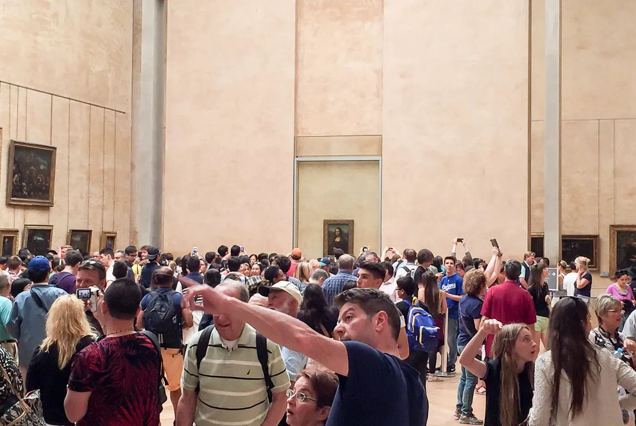 Crowds in front of the Mona Lisa at the Louvre Museum in Paris