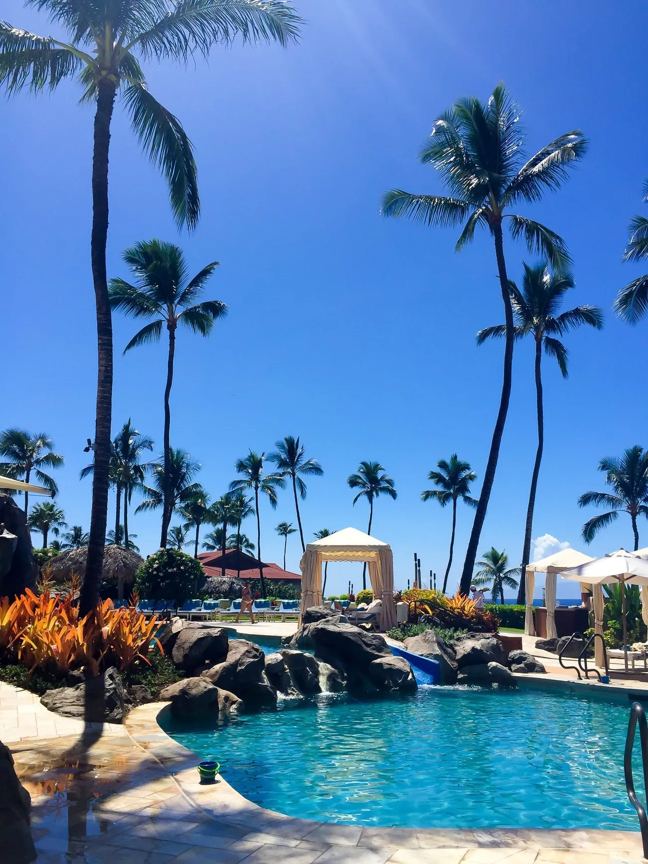 The Fountain pool at Four Seasons Resort Maui at Wailea has a water slide, and multiple swimming areas for young kids