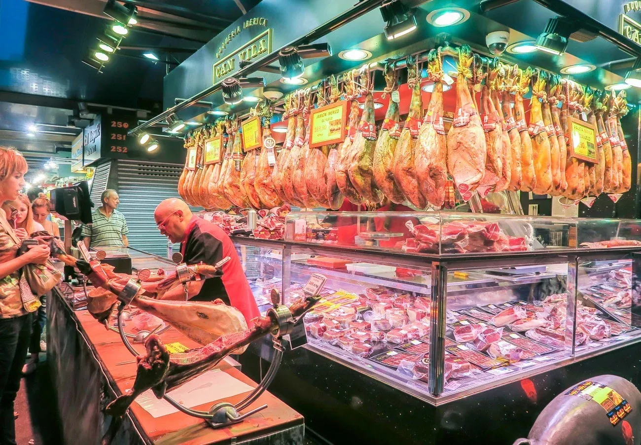 A meat vendor in La Boqueria Market in Barcelona.