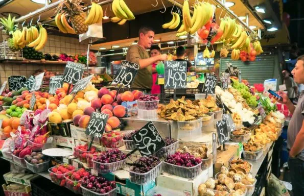 A fruit and vegetable stand at La Boqueria Market in Barcelona