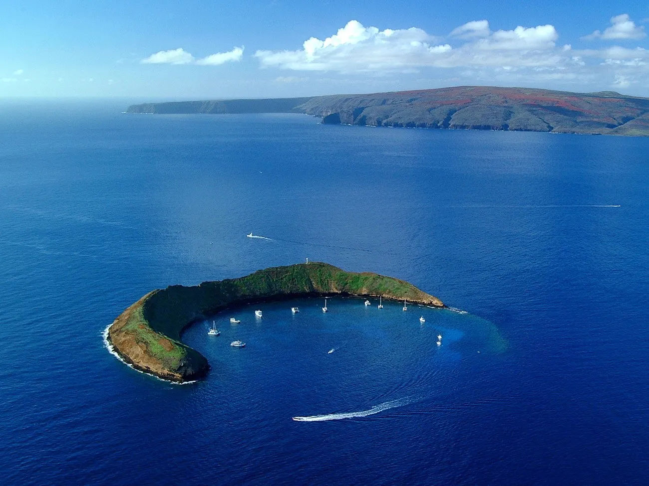 A review of our snorkeling tour around Molokini island with Kai Kanani charters and what we say underwater.