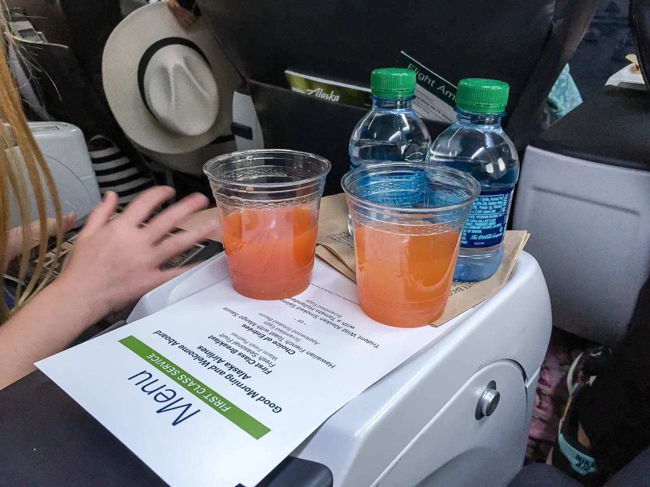 Alaska Airlines first class passionfruit mimosa served at San Diego International Airport before departure to Maui.
