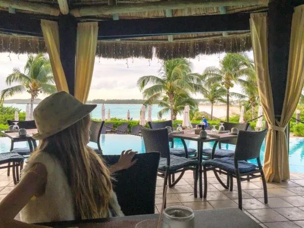 The Palapa Grill restaurant at Grand Isle Resort in the Bahamas has a beautiful pool and ocean view.