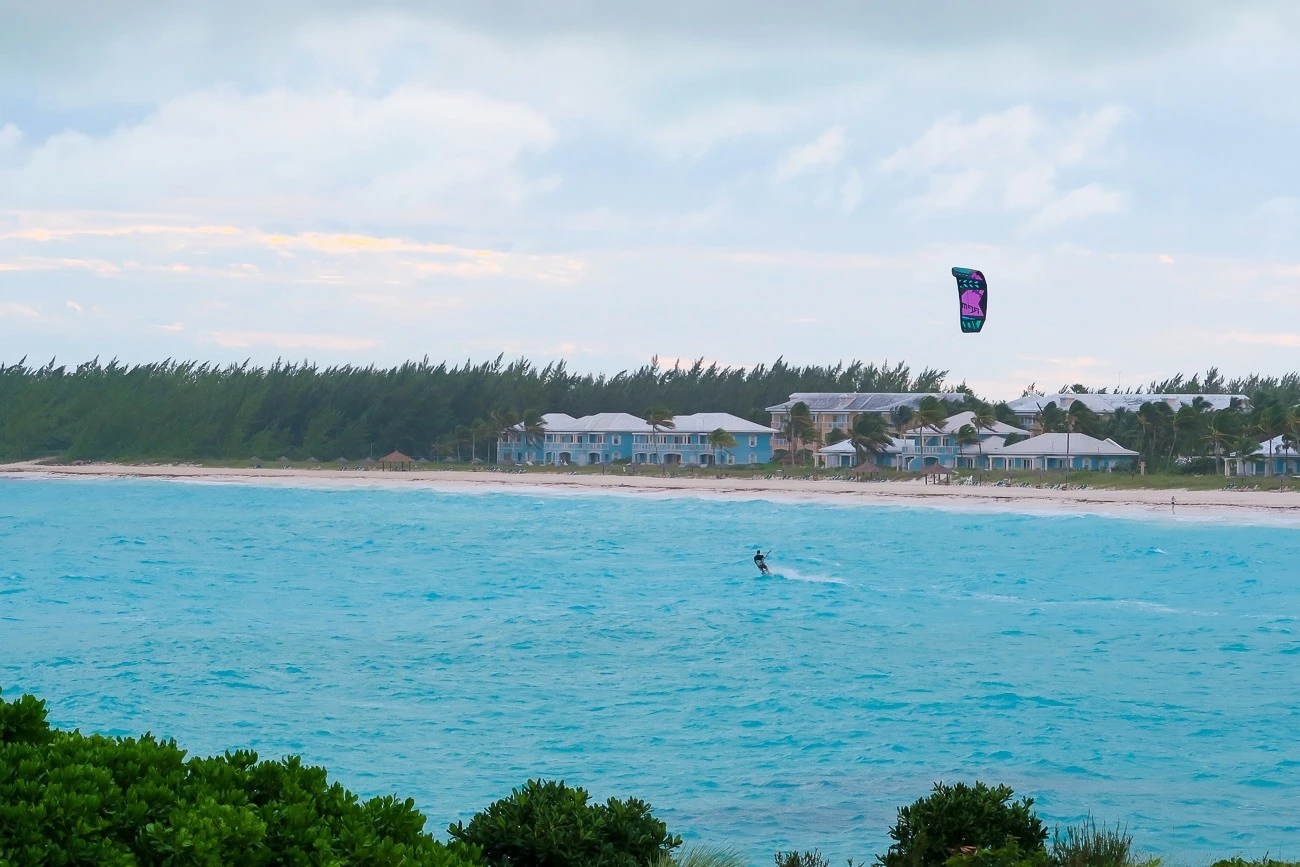 A kite surfer in front of Grand Isle Resort on Great Exuma in the Bahamas.