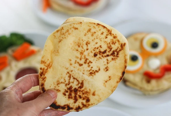 The flat side of a naan bread.