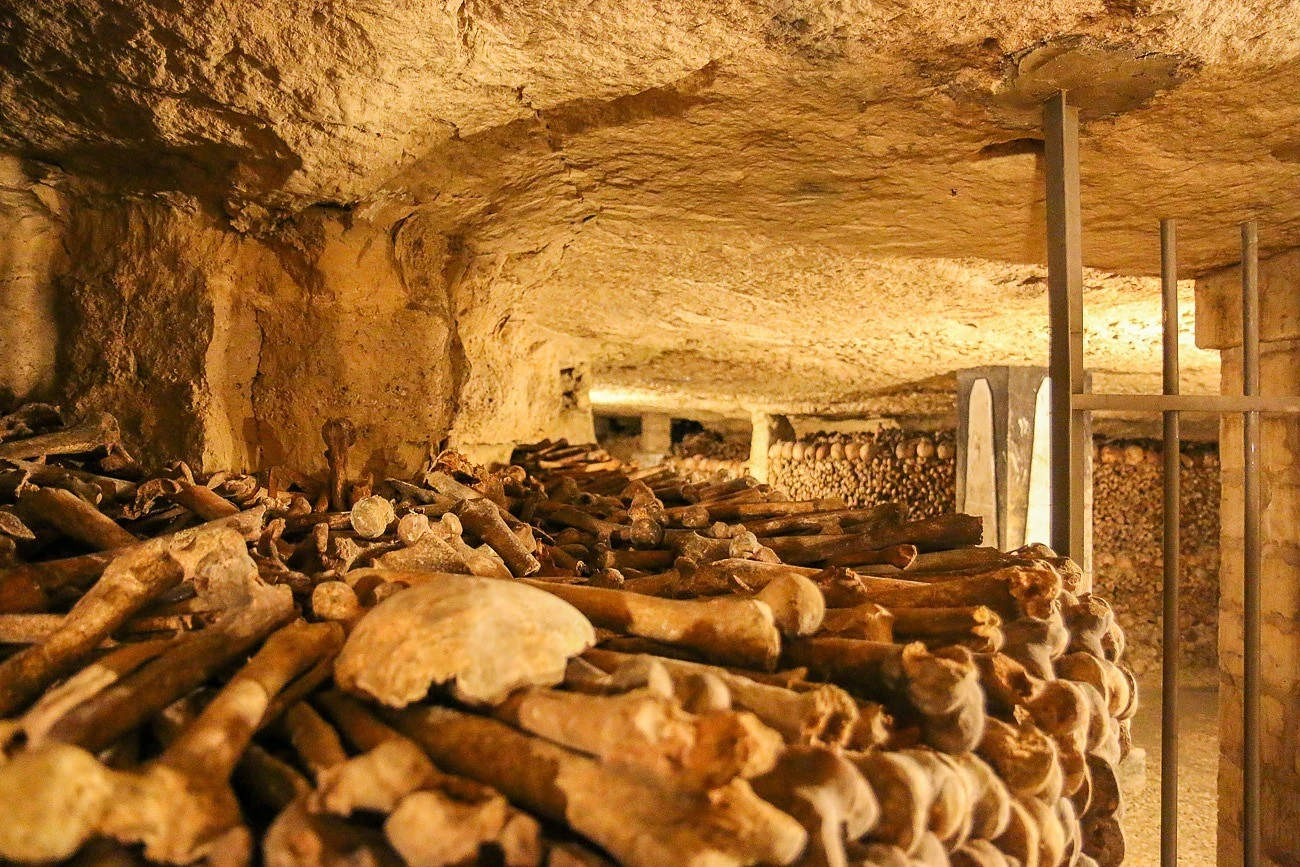 The bones of about 6 million people are stacked inside the Paris Catacombs.