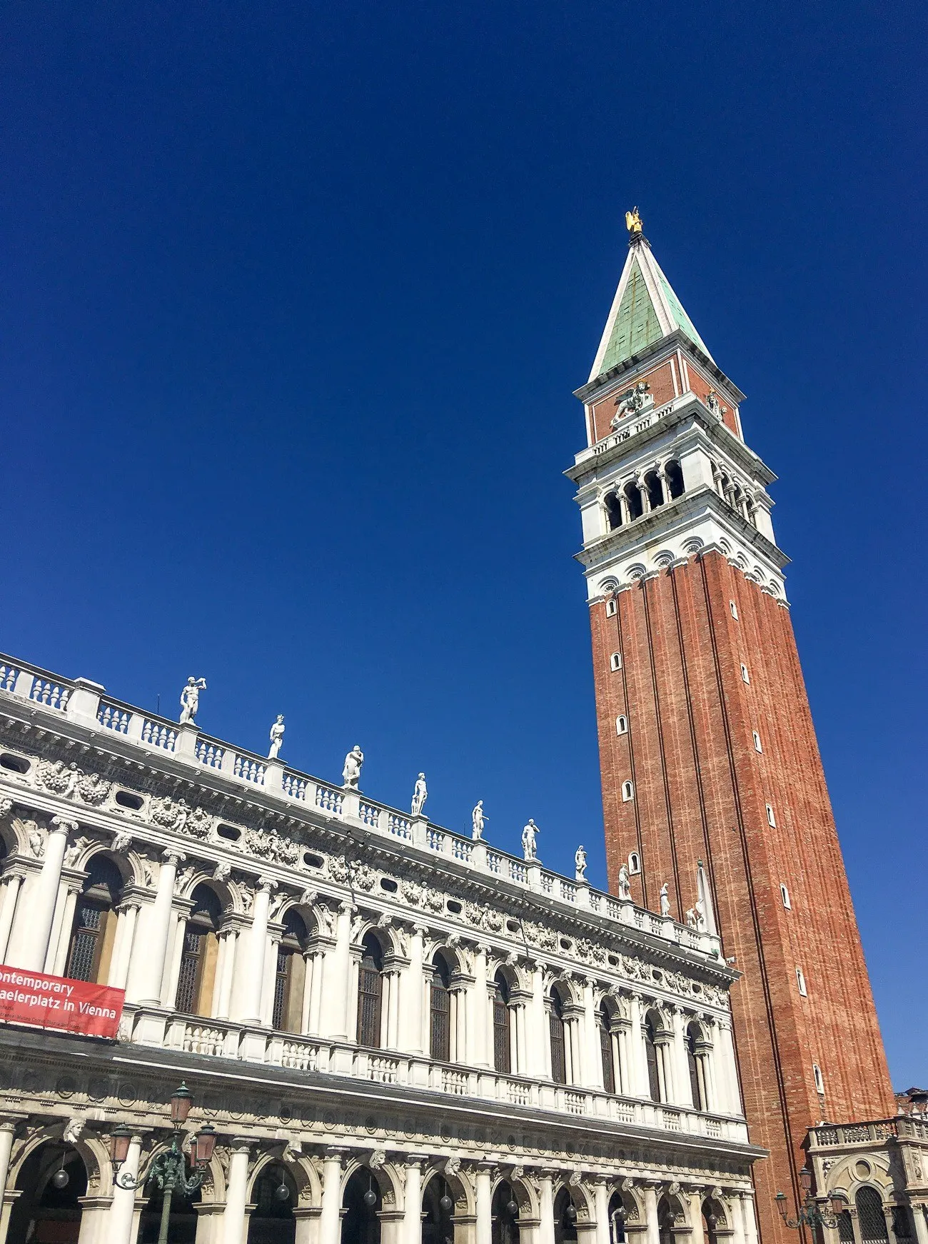 St. Mark's Bell Campanile bell tower showcases a winged lion near its top.