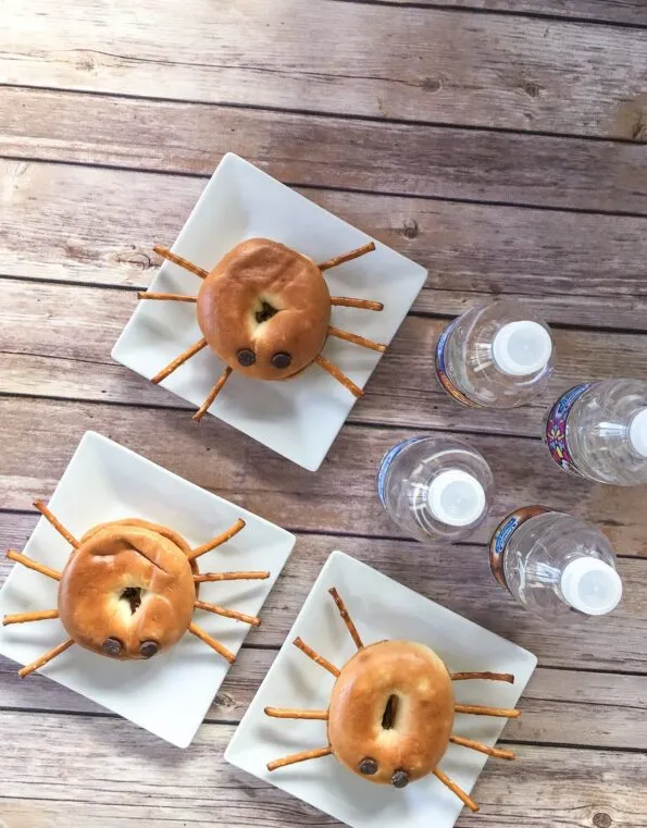 Make easy peanut butter and jelly spider mini bagels.