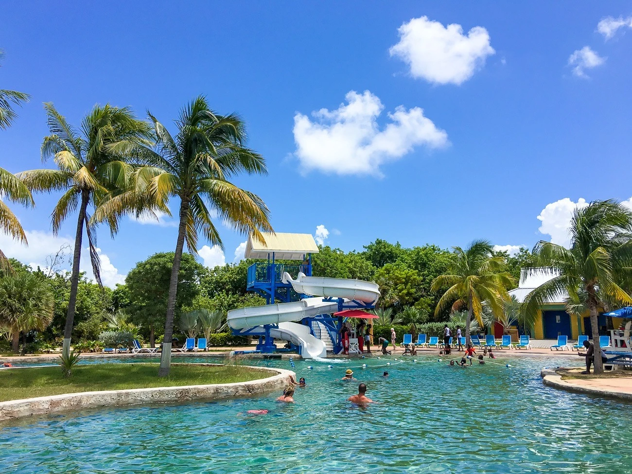 Waterslide in a pool at Cayman Turtle Centre in Grand Cayman with kids.