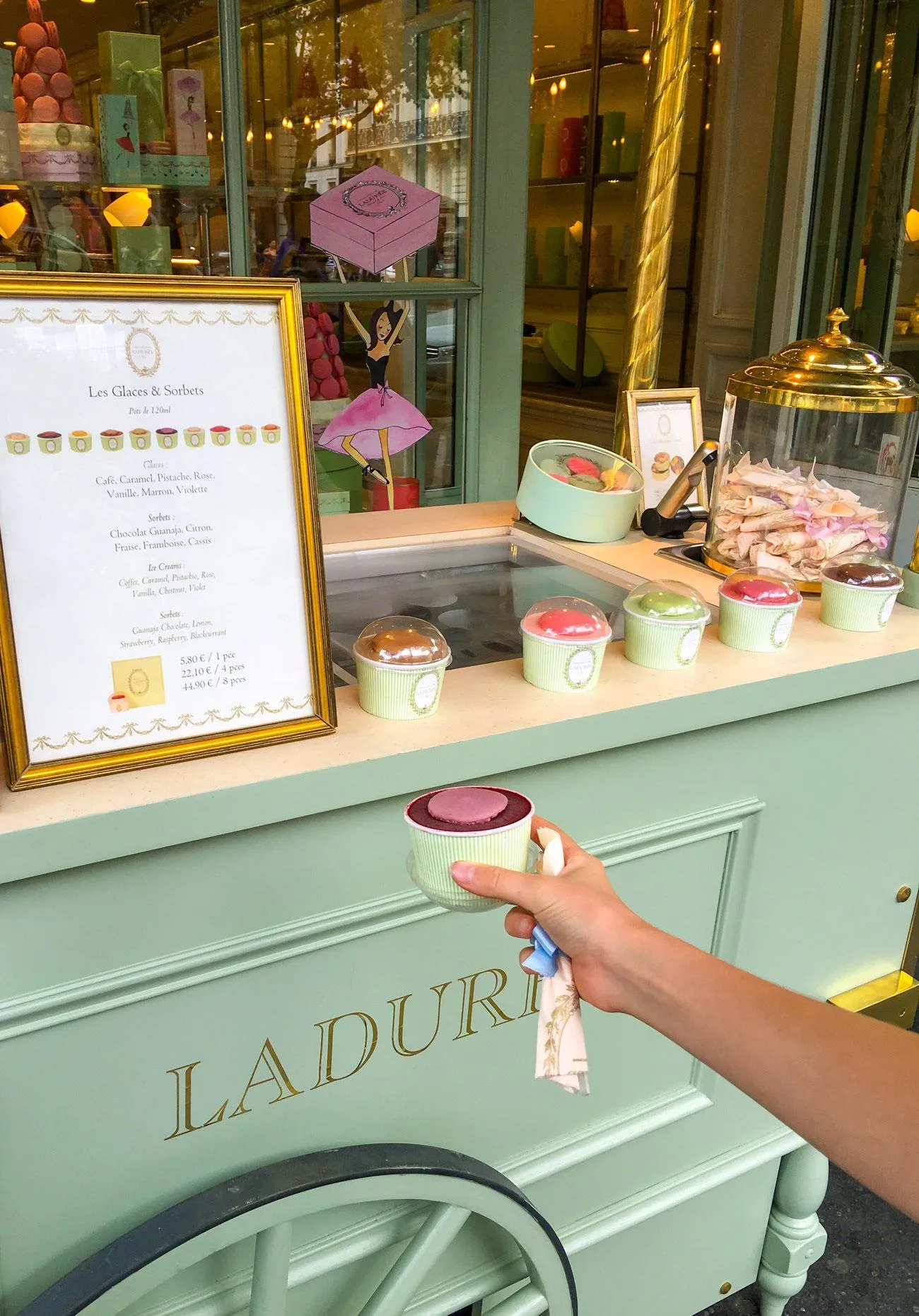 Grape gelato with a macaron on top at Laduree's rue Royal store in Paris.