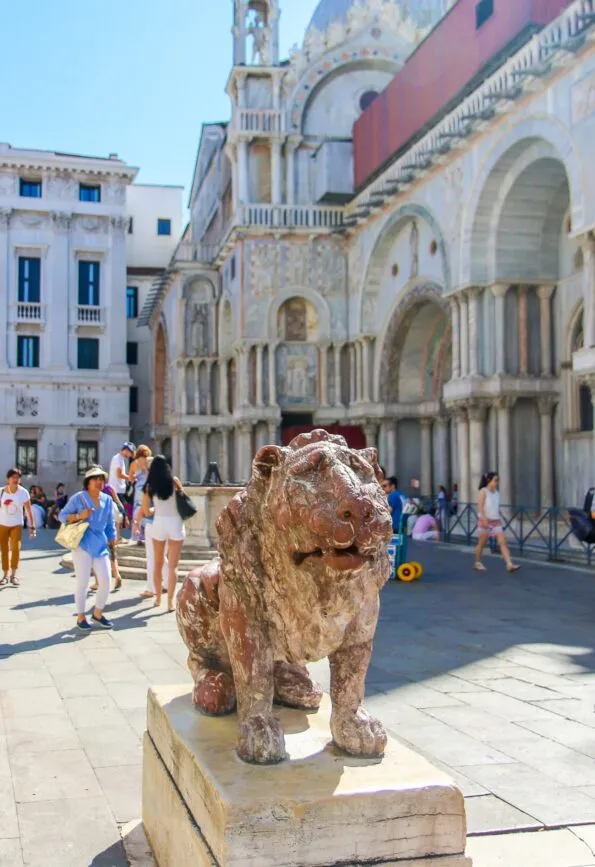 A lion near St. Mark's Basilica in Venice, Italy that we saw during a family lion hunt tour with Context Travel.