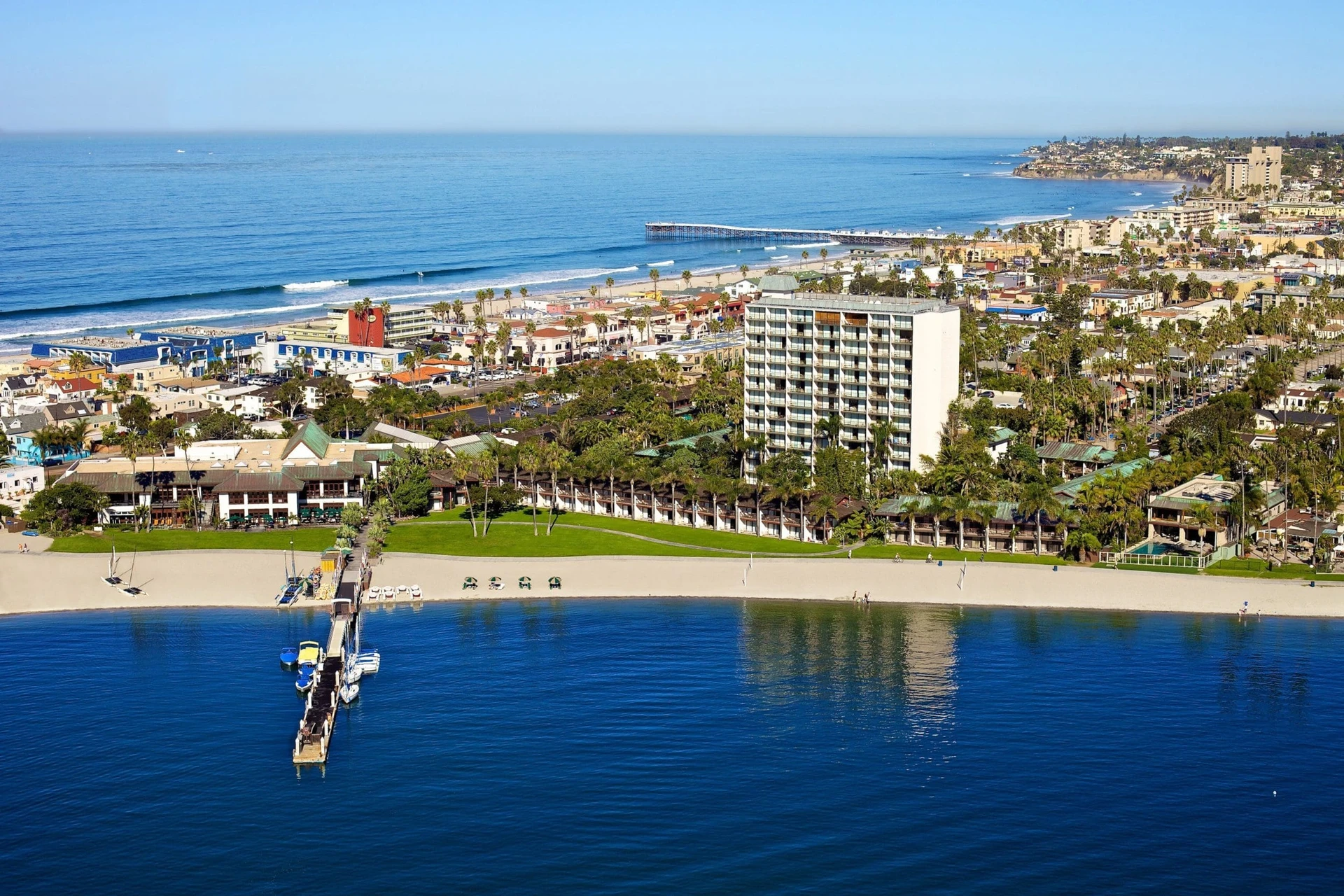 An aerial view over the bay and Catamaran Resort Hotel to the ocean and Pacific Beach.