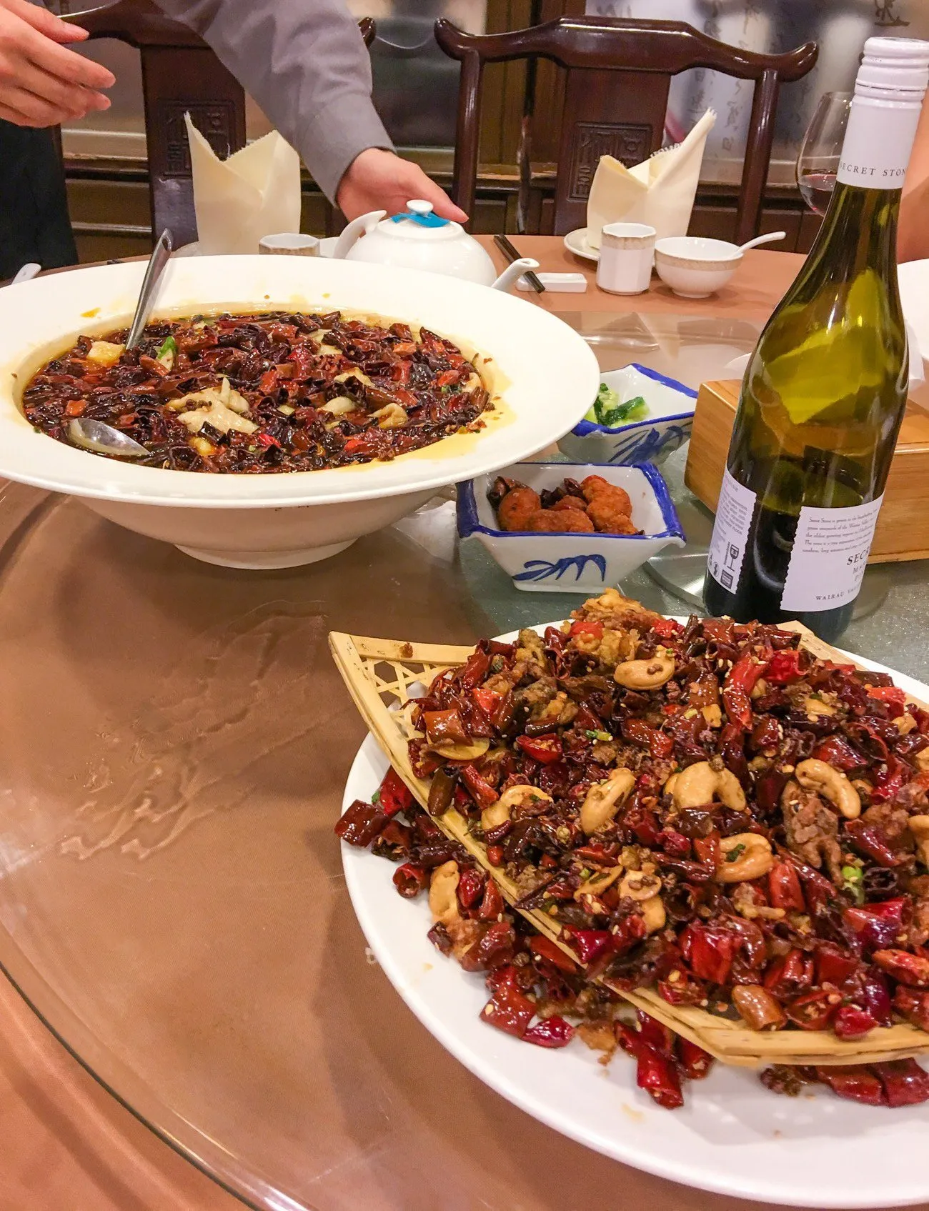 Spicy fish hot pot and chicken a table at San Xi Lou