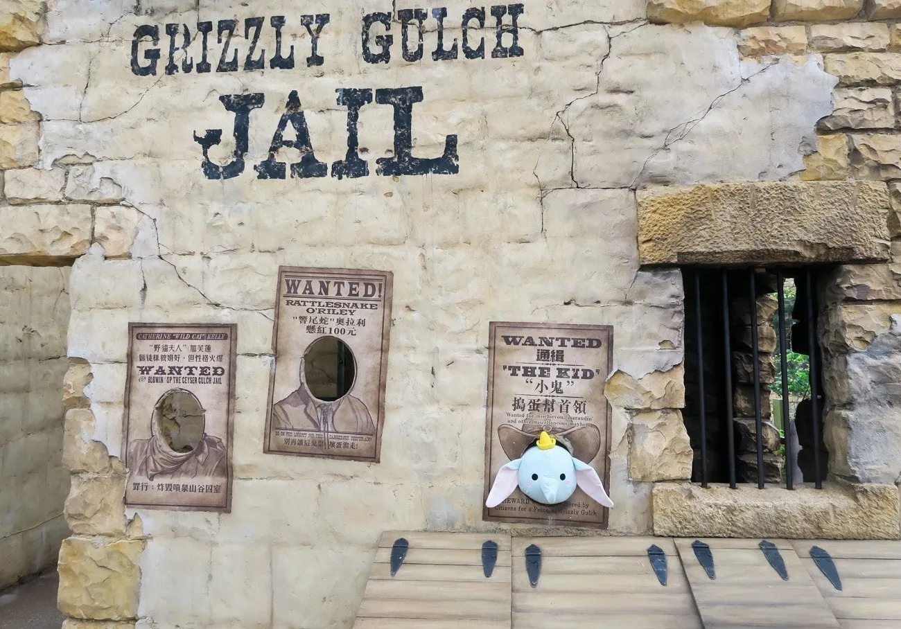 My daughter's Dumbo sticks his head out of the photo area at Grizzly Gulch at Hong Kong Disneyland