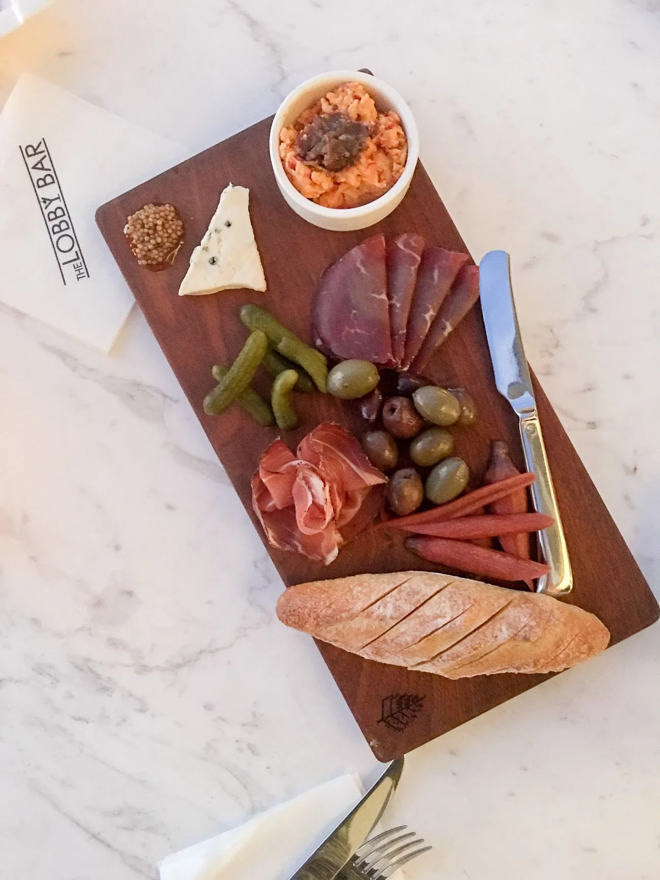 Charcuterie and cheese at The Lobby Bar inside Four Seasons Resort Orlando at Walt Disney World Resort.