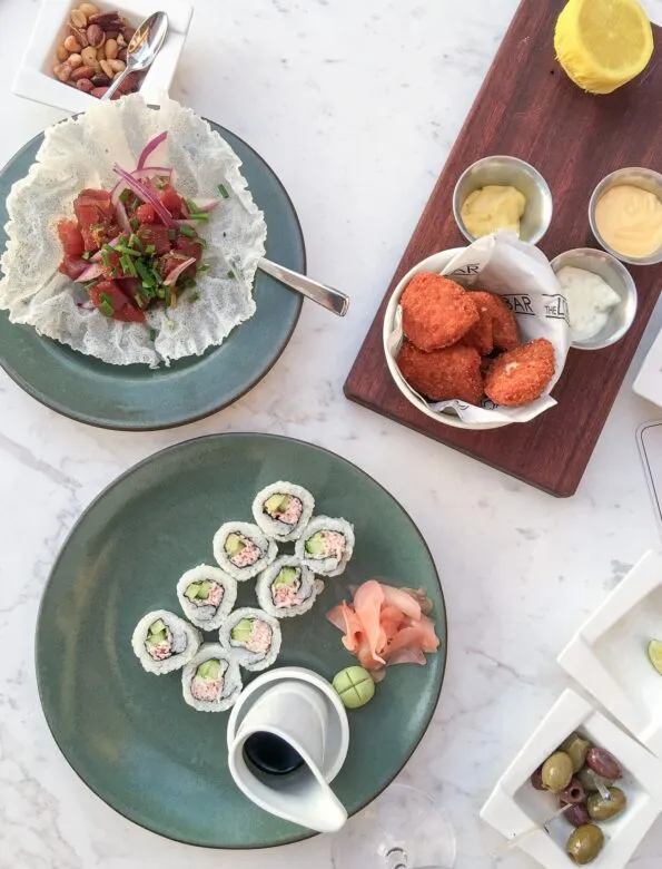 Sushi, poke and grouper bites at The Lobby Bar inside Four Seasons Resort Orlando at Walt Disney World Resort.
