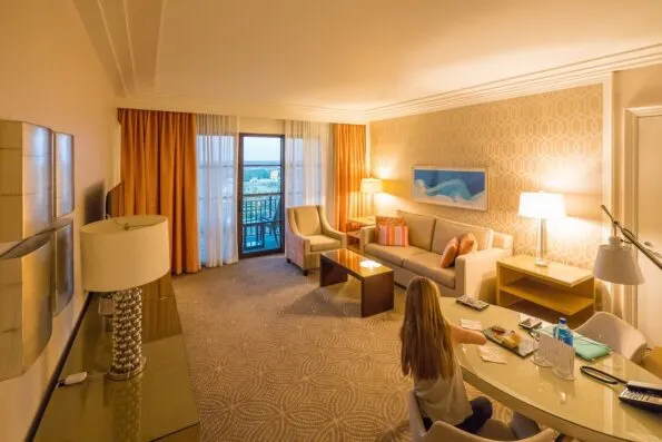 The living room of a Golden Oak View Suite at Four Seasons Resort Orlando at Walt Disney World Resort.