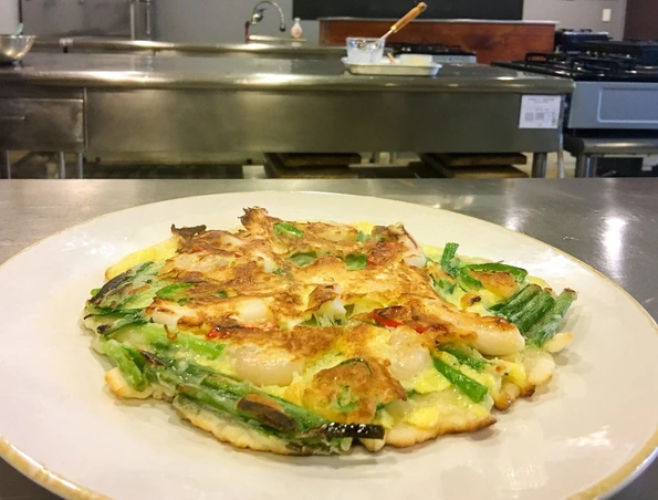 Pajeon is a delicious egg batter and scallion pancake that is a popular Korean food.