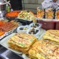 A street food vendor sells gimbap, Korean pancakes, mandu and more in Seoul's Myeongdong neighborhood.