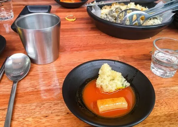 Tteokbokki (rice cakes) are a very popular Seoul street food and served with a red chili sauce.