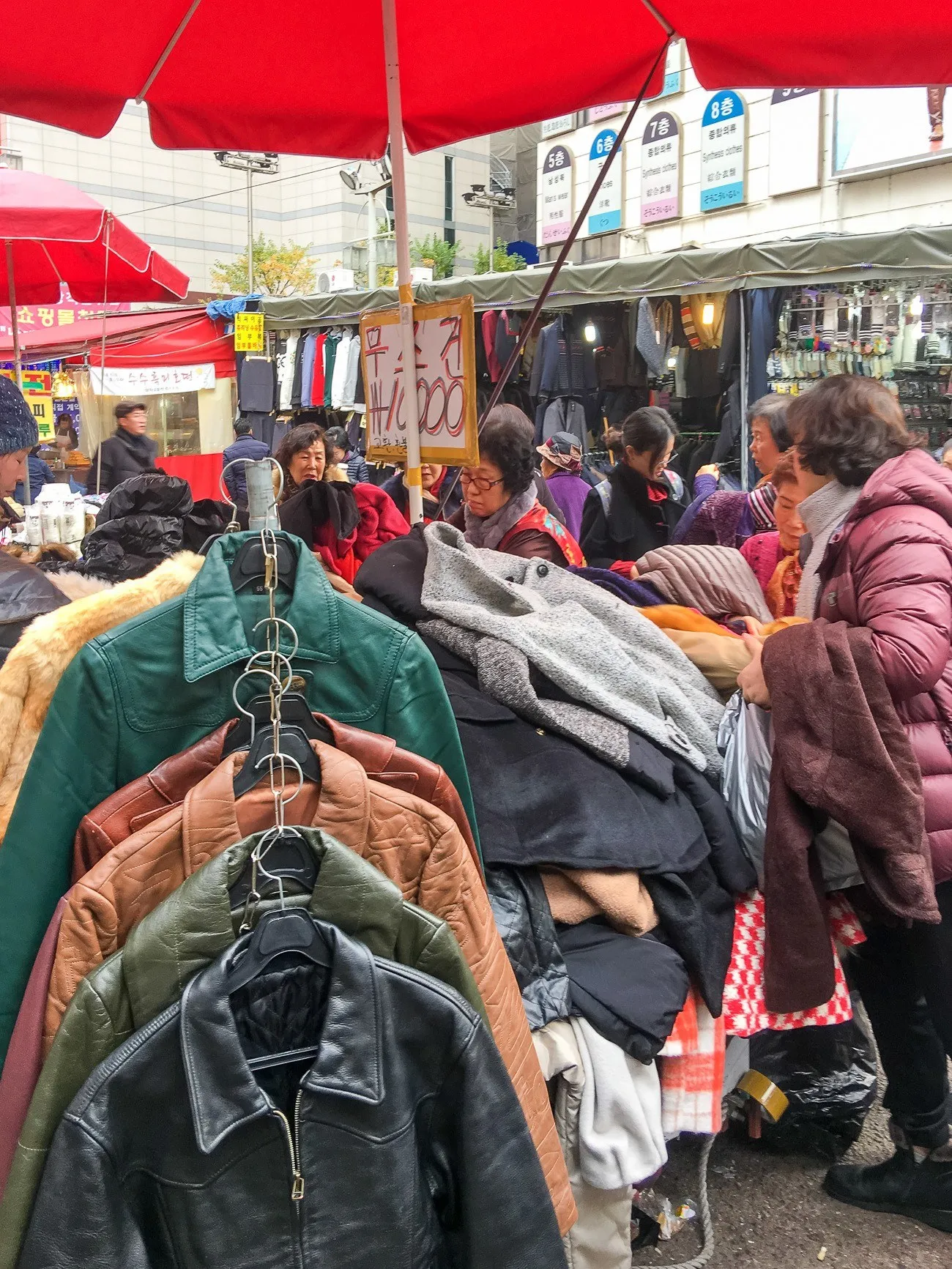 Shopping for clothing at Namdaemun Market in Seoul's Myeongdong shopping district.