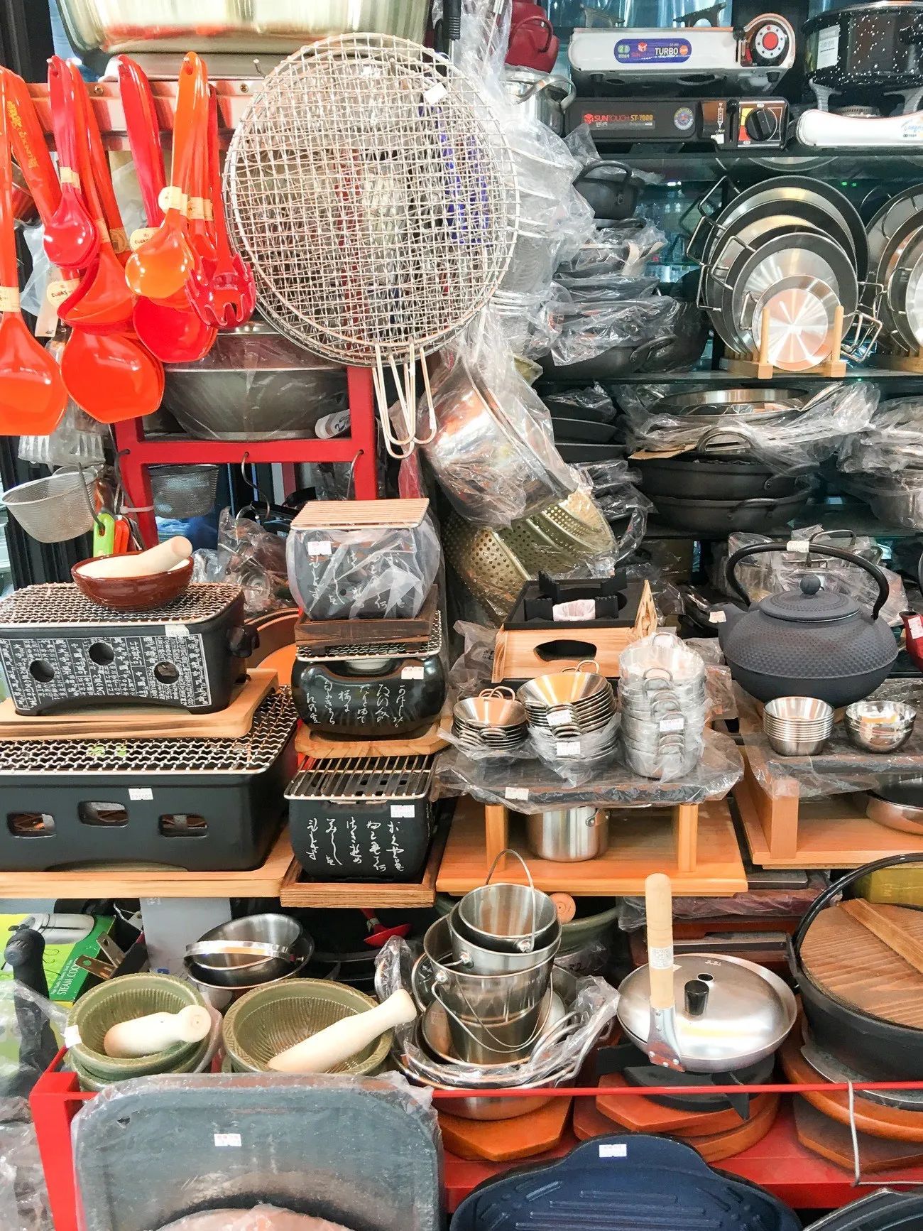 Buy housewares at Namdaemun Market in Seoul.