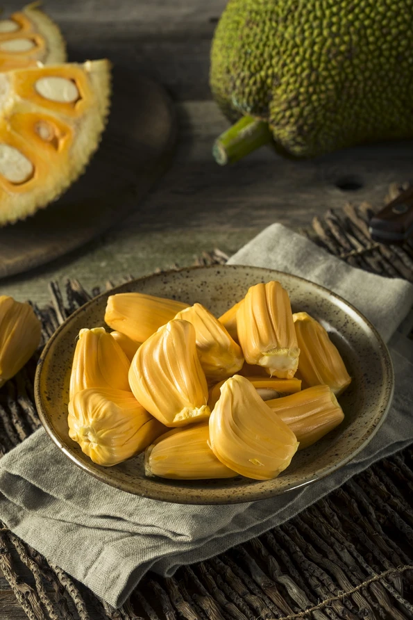 Jackfruit, one of the most exotic Asian fruit, peeled in a bowl.