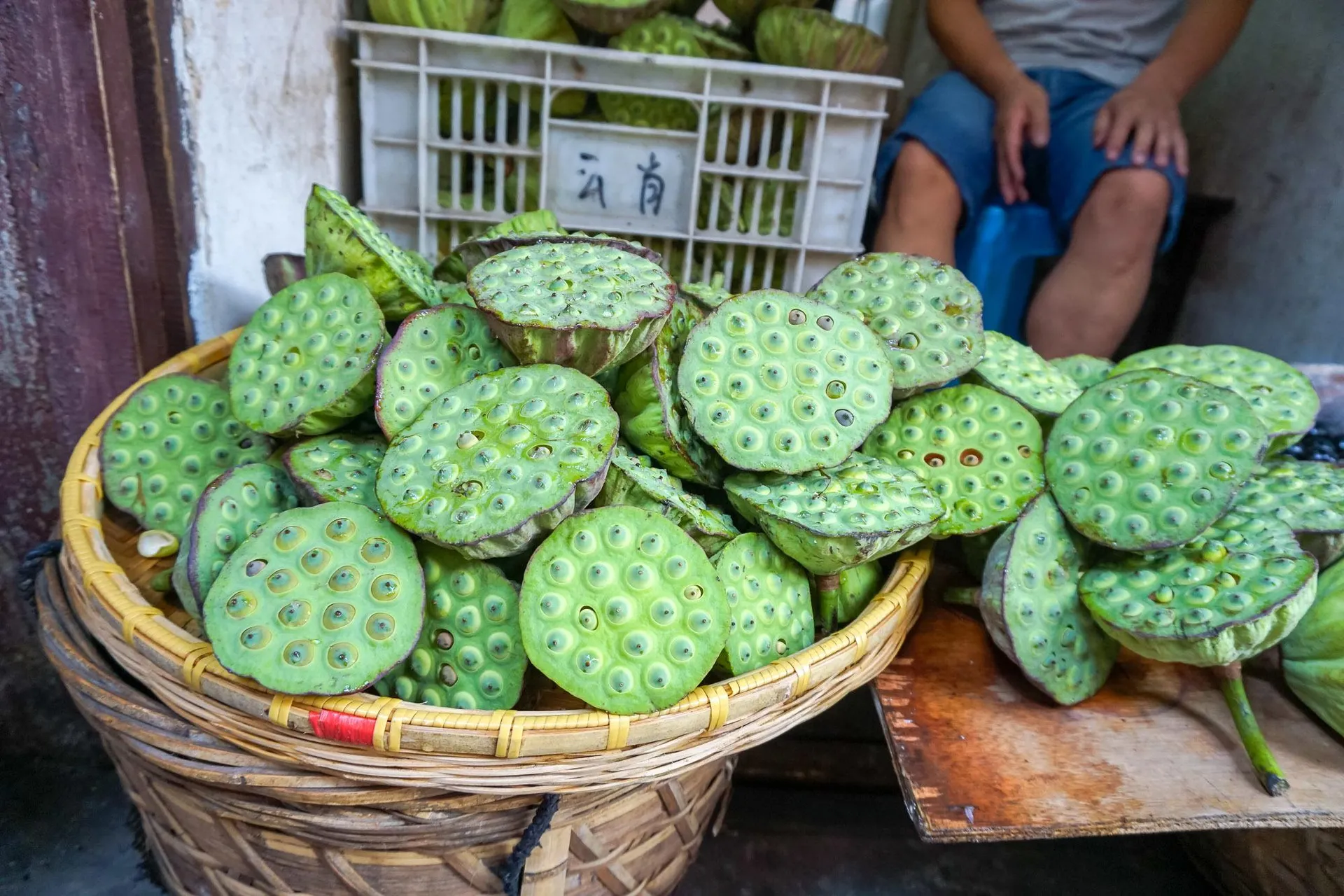 Lotus fruit in a basket in a Chinese market outside of Shanghai. are popular asian fruits where the seeds in the giant pod at the center of the flower have a lovely sweet fruit.