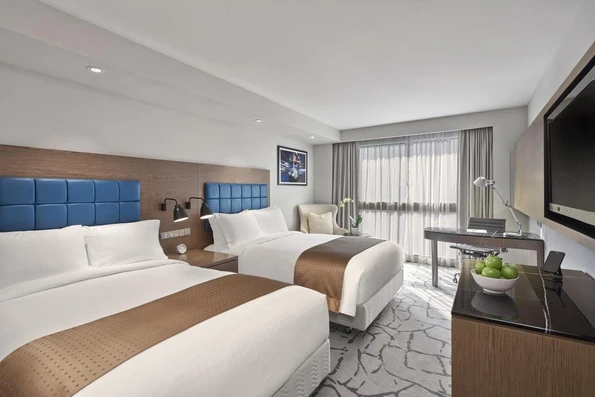 A double room interior at Holiday Inn Golden Mile, a top pick for Hong Kong family hotel.