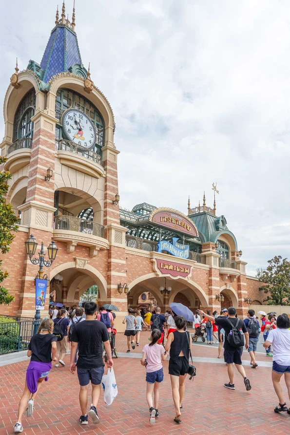 Guests walk toward the entrance to Shanghai Disneyland.