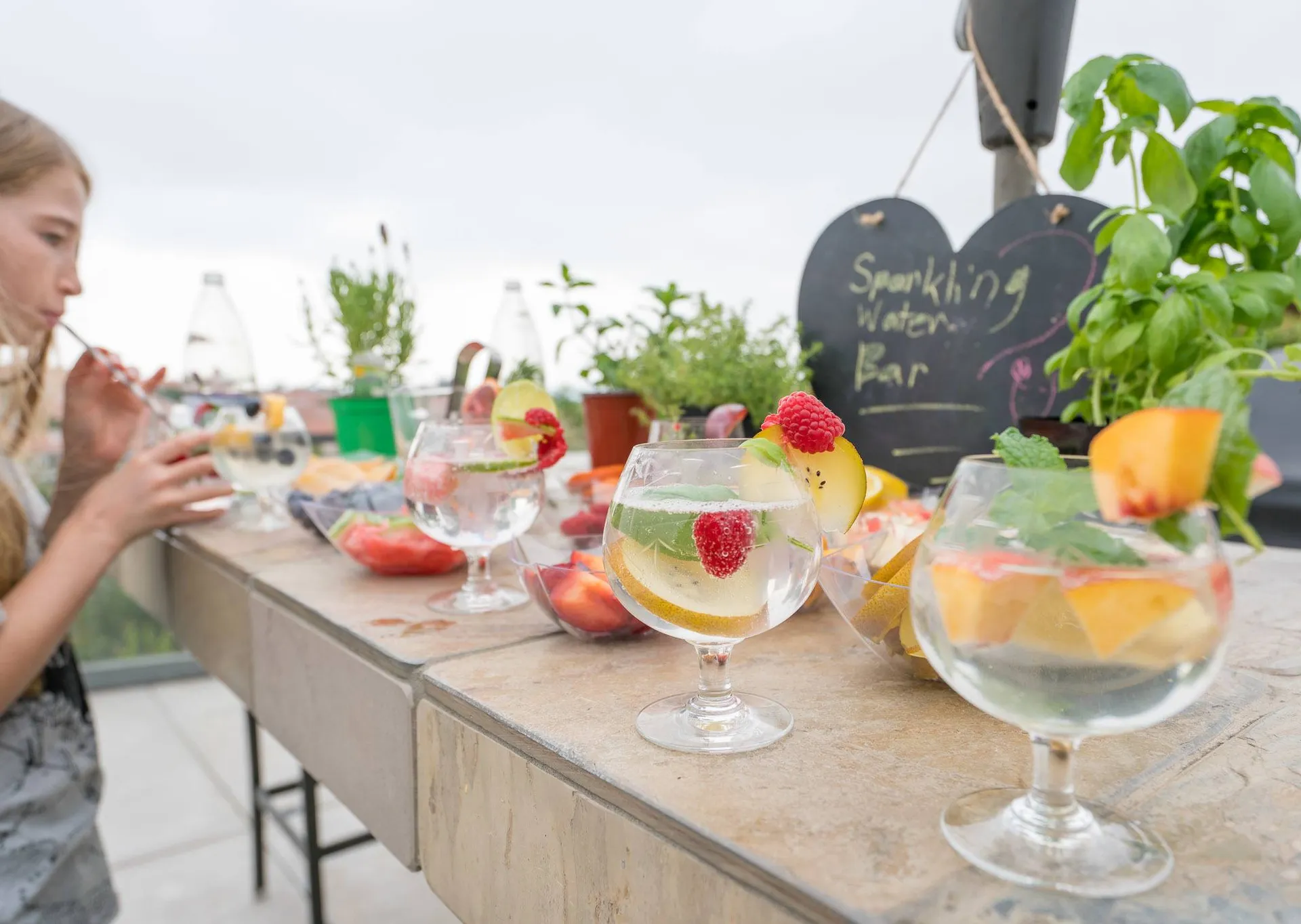 Make sparkling water drinks with fresh fruit and herbs.
