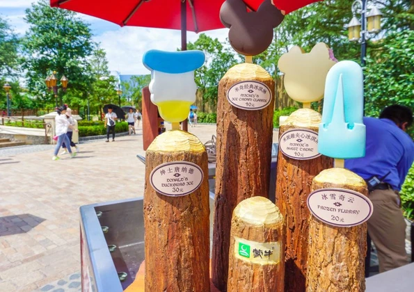 Shanghai Disneyland frozen ice cream treats on display at a snack cart.