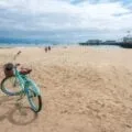 A blue bicycle on the sand of East Beach in Santa Barbara.