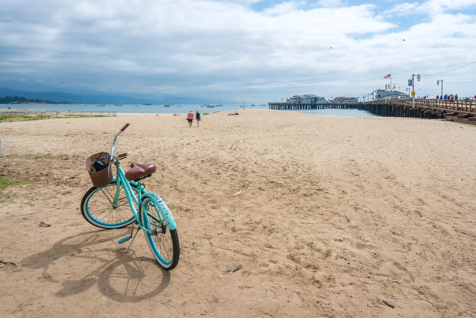 A blue bicycle on the sand of East Beach in Santa Barbara.