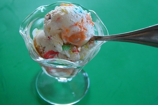 Vanilla icea cream with M&Ms in a bowl.