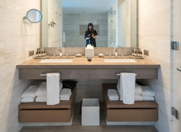 View of the bathroom sinks and storage.