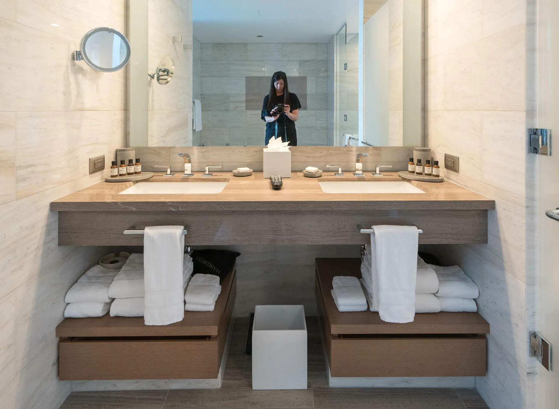 View of the bathroom sinks and storage.