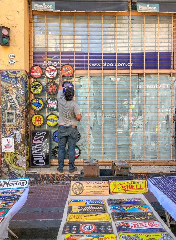 A vendor gets ready for the day at the San Telmo Fair in Buenos Aires.