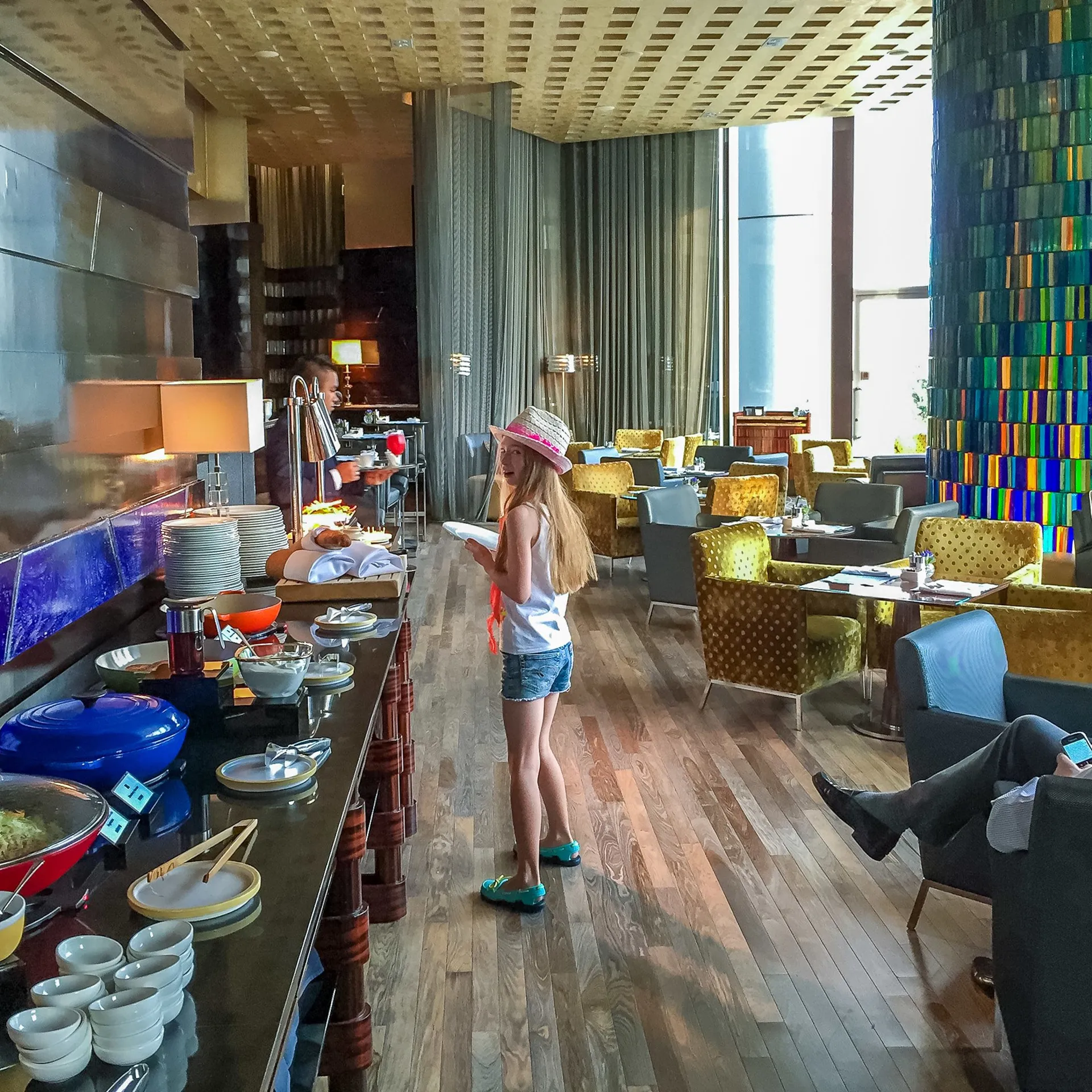 My daughter decides what to eat at the Blue Bar buffet.