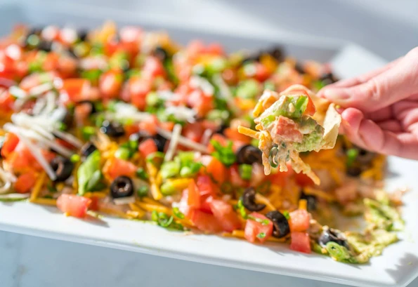 This easy 7 layer dip recipe will be the hit of your party.