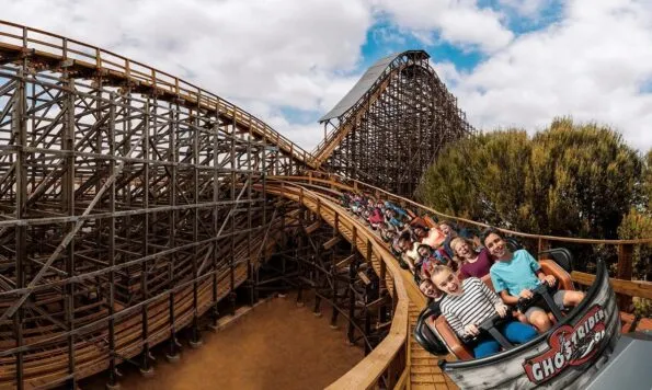 Guests ride the Ghost Rider roller coaster at Knott's Berry Farm.