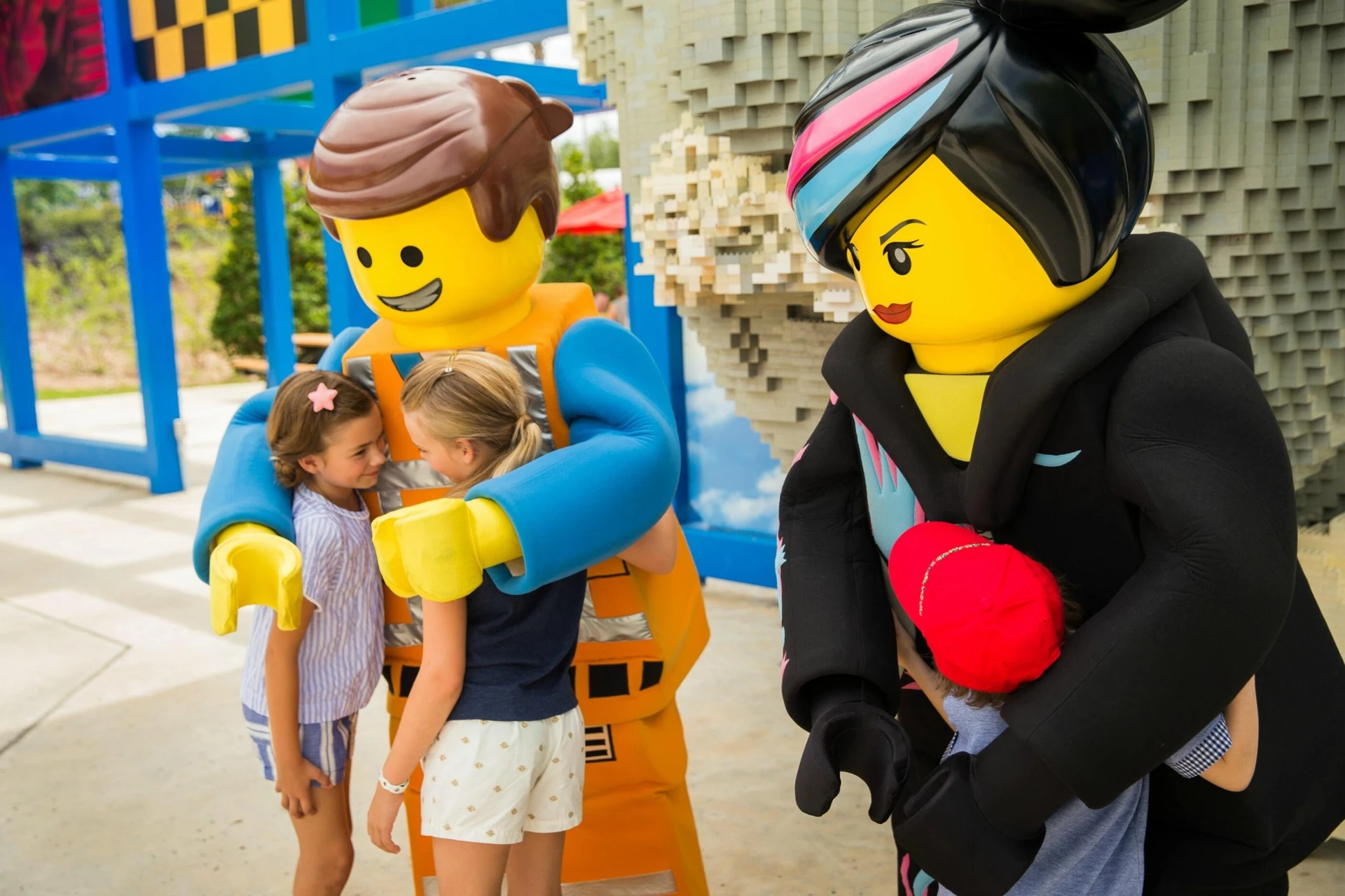 Two LEGO characters greet guests