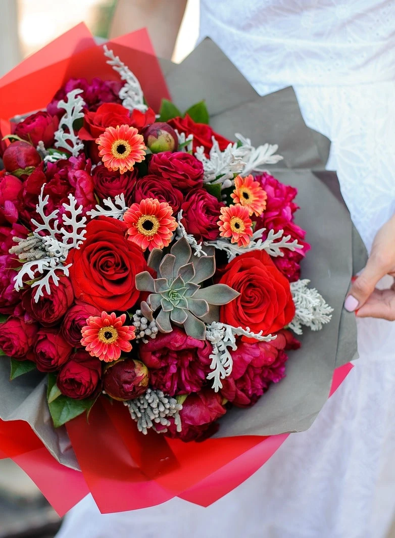 Peonies, roses and succulents in a bouquet