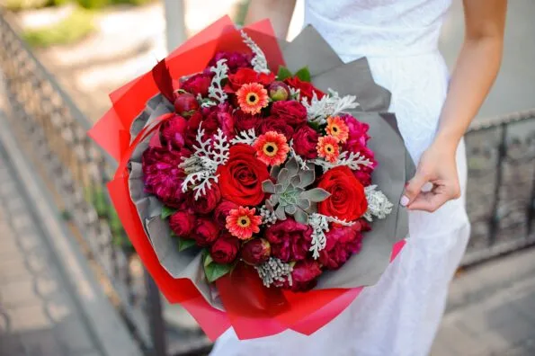 A red rose and succulent bouquet