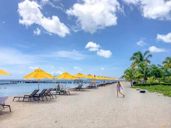 My daughter walks down the beach in front of Four Seasons Nevis