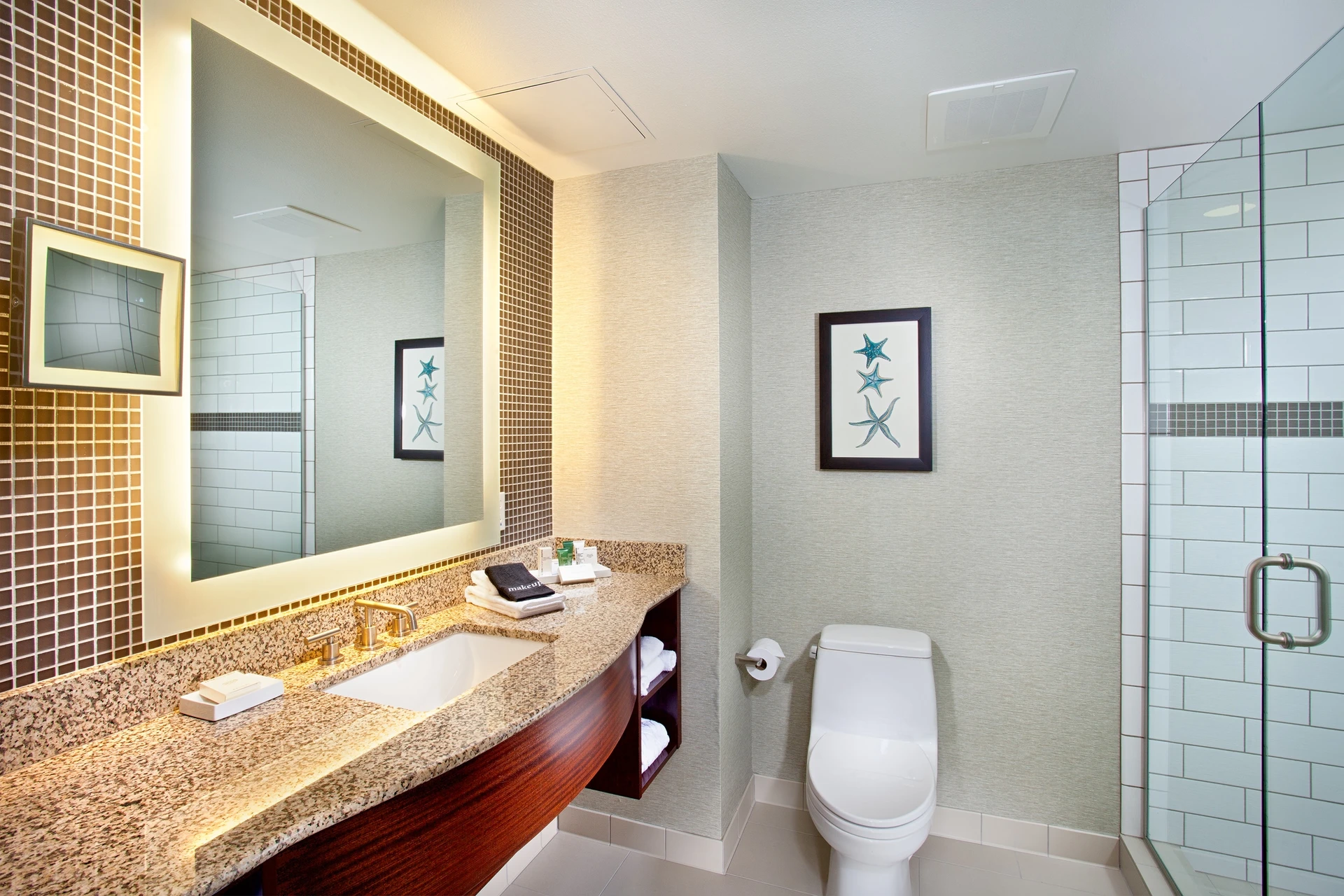 A bathroom at Cape Rey Carlsbad, a Hilton Resort.