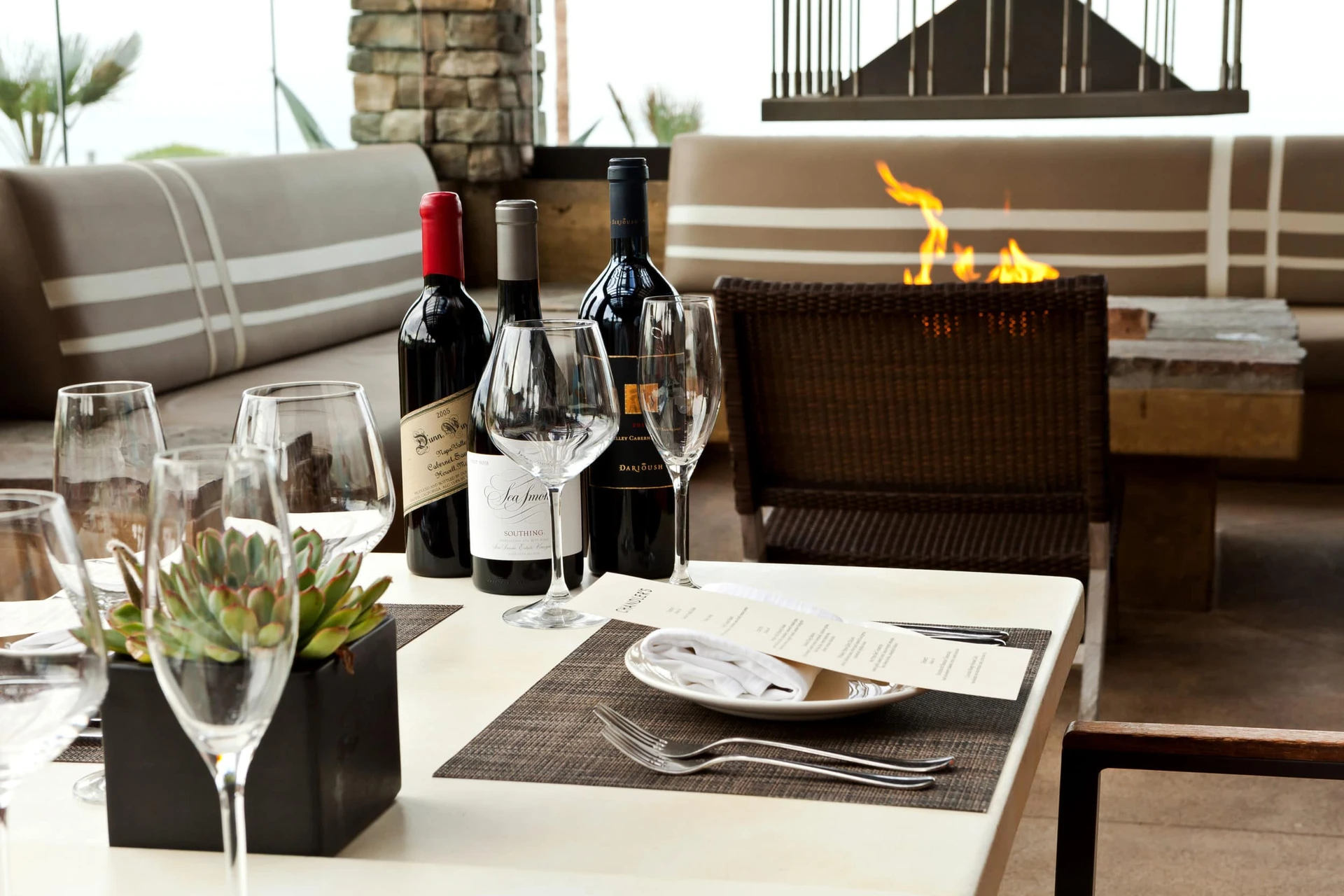 Tables set for outdoor dining at Cape Rey Carlsbad.